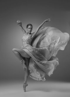 The beautiful ballerina dancing in blue long dress The beautiful ballerina dancing in blue long dress